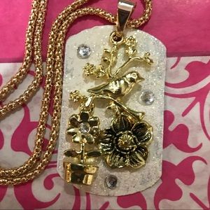 Flowering bird dog tag necklace
